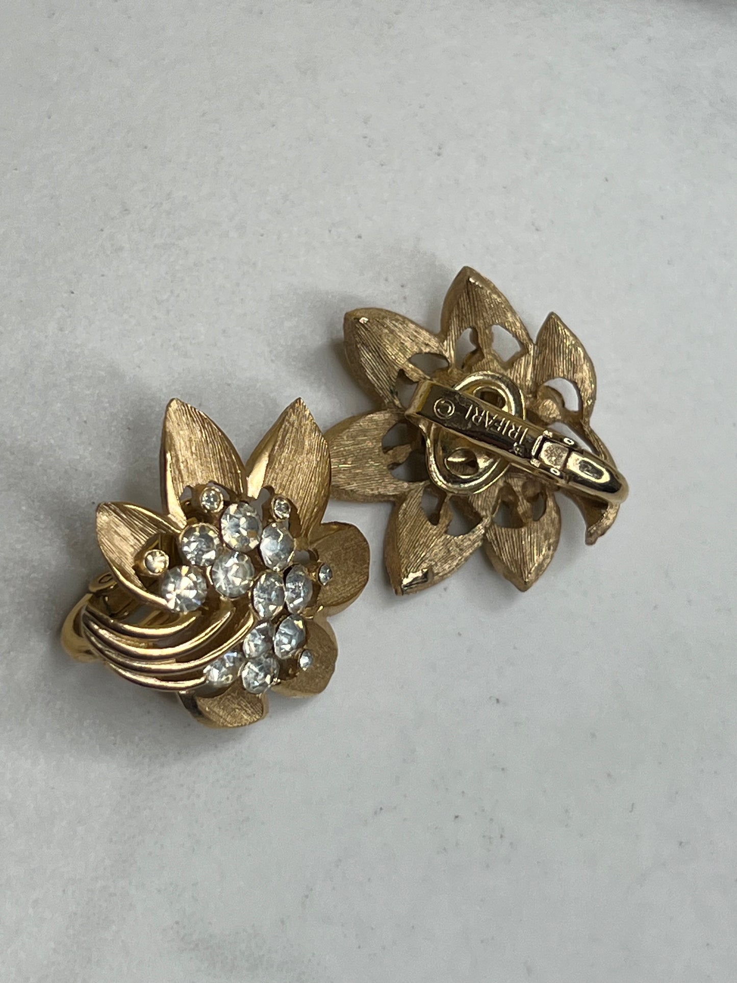 Signed Trifari Gold Rhinestone Starburst Flower Brooch and Clip on Earrings